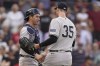 New York Yankees catcher Kyle Higashioka, left, and pitcher Clay Holmes (35) celebrate after beating the Boston Red Sox in the first game of a baseball doubleheader, Tuesday, Sept. 12, 2023, in Boston. (AP Photo/Steven Senne)