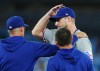 Texas Rangers starting pitcher Max Scherzer, right, is checked on by pitching coach Mike Maddux, left, during sixth inning American League MLB baseball action agains the Toronto Blue Jays in Toronto on Tuesday, September 12, 2023. THE CANADIAN PRESS/Nathan Denette