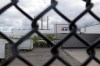 General Motor's Lansing Grand River Assembly plant is seen behind a fence , Tuesday, Sept. 12, 2023, in Lansing, Mich., where workers could soon be on the outside looking in with a potential strike set to begin on Thursday night. (AP Photo/Joey Cappelletti)