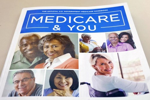 FILE - In this Nov. 8, 2018 file photo, the U.S. Medicare Handbook is photographed in Washington. Making more than the maximum income level for Medicaid isn’t necessarily a deal breaker. After a long pause during the COVID-19 public health emergency, states have resumed checking whether Medicaid beneficiaries’ income meets the eligibility requirements. (AP Photo/Pablo Martinez Monsivais)