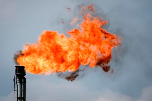 A flare stack burns off excess gas at a processing facility near Crossfield, Alta., Tuesday, June 13, 2023. Most Albertans would support some kind of national cap on carbon emissions from the oil and gas sector, two new polls suggest. THE CANADIAN PRESS/Jeff McIntosh