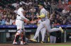 Oakland Athletics' Ryan Noda, right, scores in front of Houston Astros catcher Yainer Diaz, left, on a sacrifice fly by Shea Langeliers during the ninth inning of a baseball game Wednesday, Sept. 13, 2023, in Houston. (AP Photo/Michael Wyke)