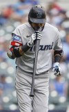 Miami Marlins' Luis Arraez reacts after flying out against the Milwaukee Brewers during the fifth inning of a baseball game Thursday, Sept. 14, 2023, in Milwaukee. (AP Photo/Jeffrey Phelps)