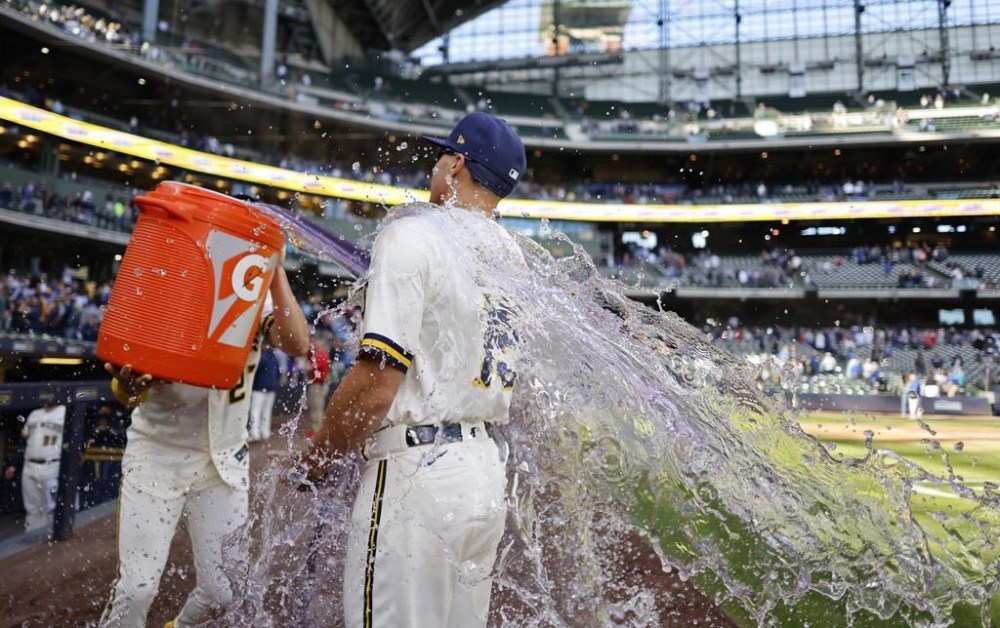 Milwaukee Brewers' Willy Adames douses Tyrone Taylor with Gatorade after a baseball game against the Miami Marlins, Thursday, Sept. 14, 2023, in Milwaukee. (AP Photo/Jeffrey Phelps)