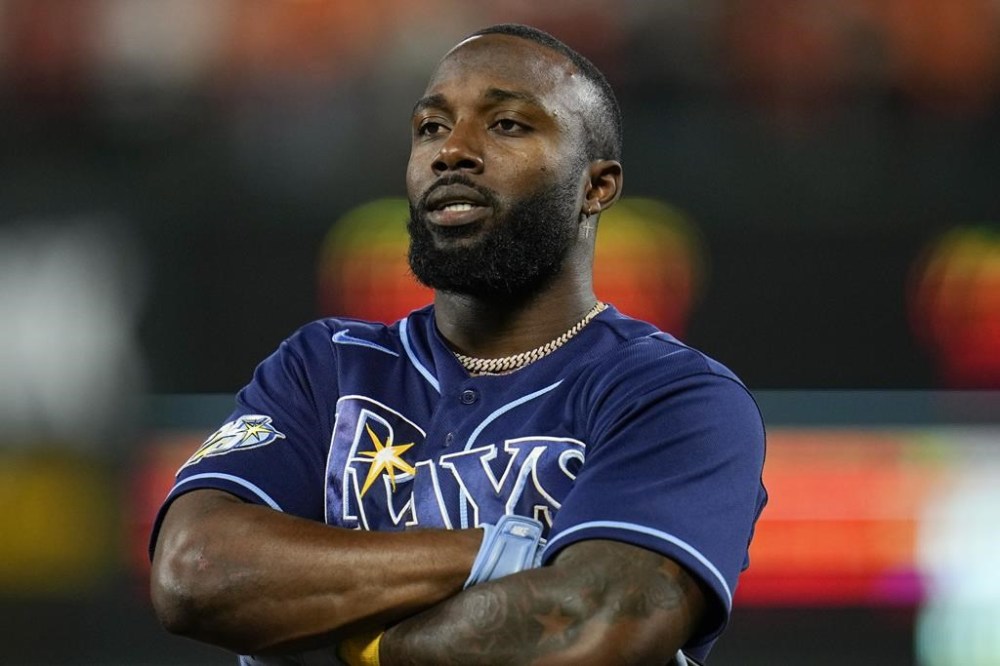 Tampa Bay Rays' Randy Arozarena reacts after hitting a two-run triple to score Yandy Diaz and Brandon Lowe in the third inning of a baseball game against the Baltimore Orioles, Thursday, Sept. 14, 2023, in Baltimore. (AP Photo/Julio Cortez)
