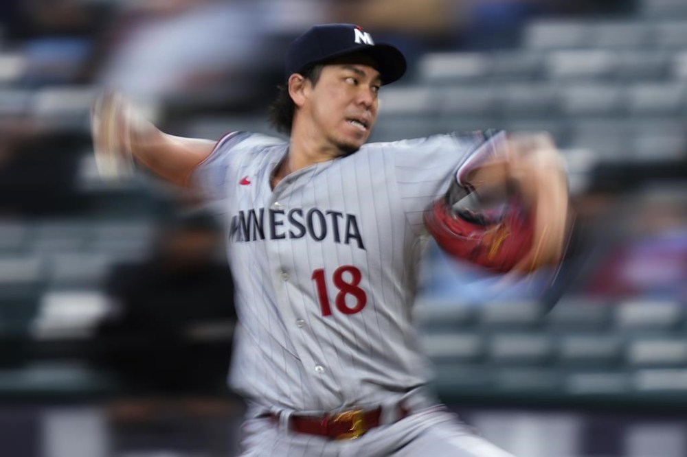 Minnesota Twins starting pitcher Kenta Maeda throws to a Chicago White Sox batter during the first inning of a baseball game in Chicago, Thursday, Sept. 14, 2023. (AP Photo/Nam Y. Huh)