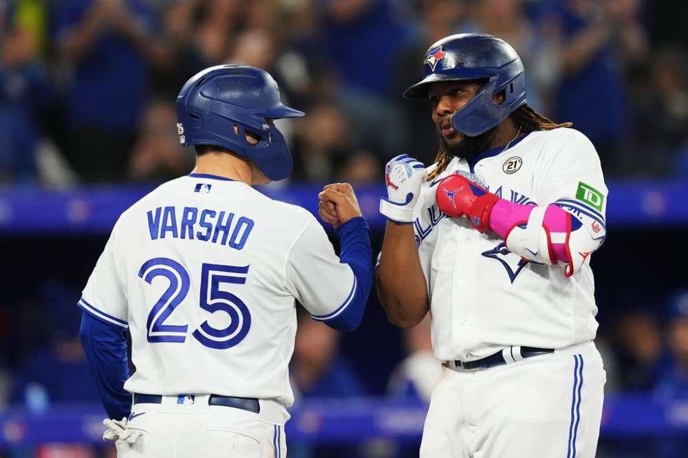 Toronto Blue Jays' Vladimir Guerrero Jr. celebrates his three-run home run against the Boston Red Sox with Daulton Varsho (25) during third inning American League MLB baseball action in Toronto on Friday, September 15, 2023. THE CANADIAN PRESS/Chris Young