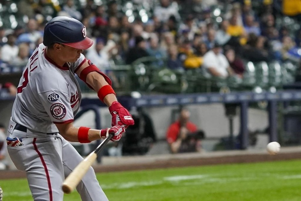 Washington Nationals' Alex Call hits a double during the seventh inning of a baseball game against the Milwaukee Brewers Friday, Sept. 15, 2023, in Milwaukee. (AP Photo/Morry Gash)