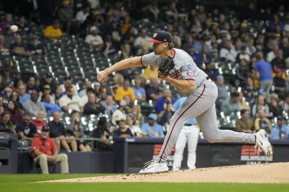 Washington Nationals starting pitcher Jake Irvin throws during the first inning of a baseball game against the Milwaukee Brewers Friday, Sept. 15, 2023, in Milwaukee. (AP Photo/Morry Gash)