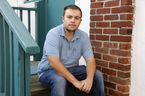 Mike Bouboulis sits for a portrait in Arlington, Mass., on Wednesday, Sept. 13, 2023. Bouboulis has taken Saxenda, Mounjaro or Ozempic, a Novo diabetes drug with the same active ingredient as Wegovy, since around 2019. In the past year after their popularity exploded, refilling a prescription involved calling five to seven pharmacies. “They all know what you’re calling for, and they all have the same answer: ‘I don’t know. We’ll see tomorrow,’