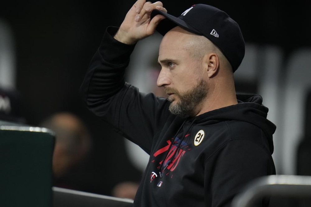 Minnesota Twins manager Rocco Baldelli sits in the dugout during the first inning of a baseball game against the Chicago White Sox, Friday, Sept. 15, 2023, in Chicago. (AP Photo/Erin Hooley)