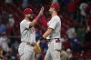 Philadelphia Phillies' Kyle Schwarber, left, and teammate Trea Turner celebrate a 6-1 victory over the St. Louis Cardinals following a baseball game Saturday, Sept. 16, 2023, in St. Louis. (AP Photo/Jeff Roberson)