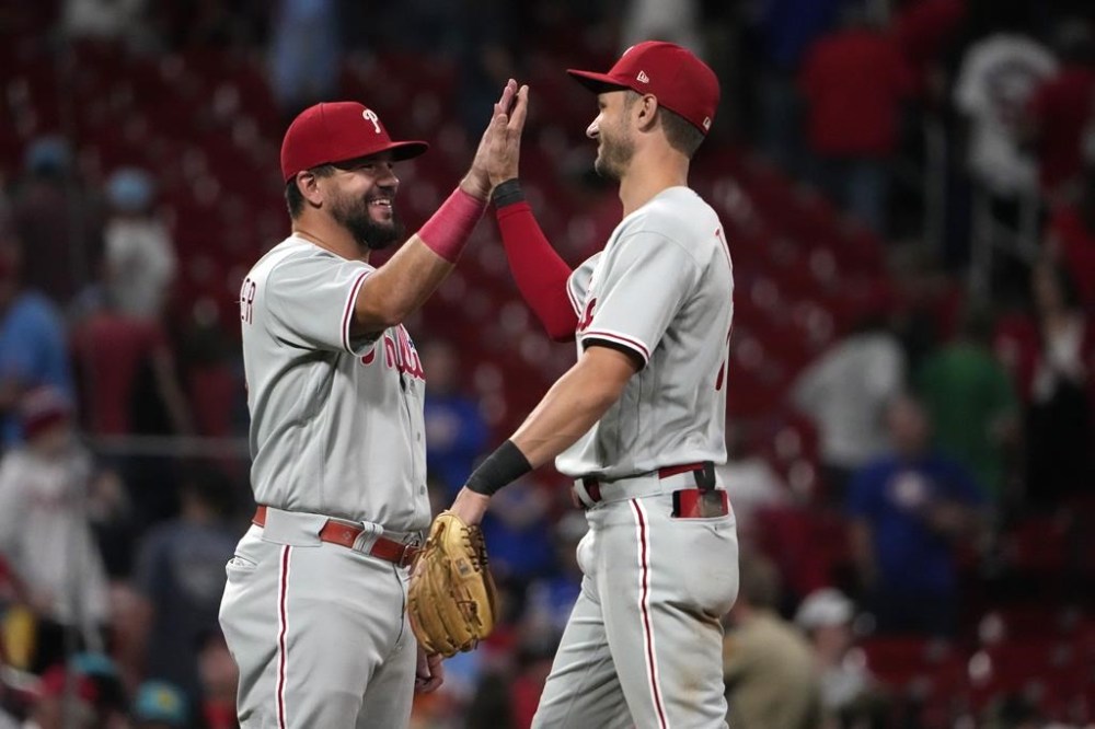 Philadelphia Phillies' Kyle Schwarber, left, and teammate Trea Turner celebrate a 6-1 victory over the St. Louis Cardinals following a baseball game Saturday, Sept. 16, 2023, in St. Louis. (AP Photo/Jeff Roberson)