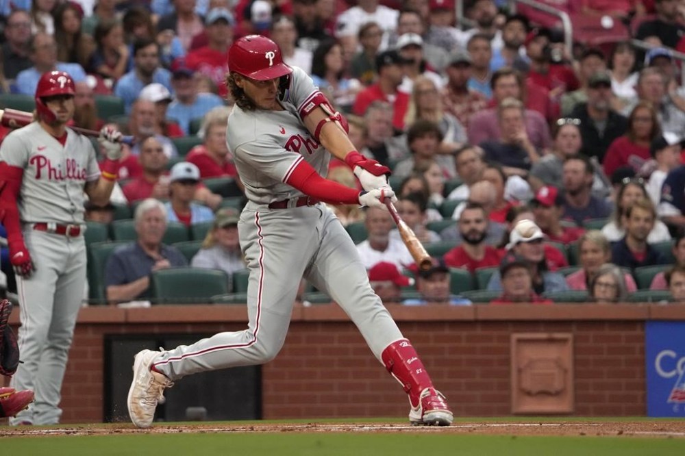 Philadelphia Phillies' Alec Bohm hits an RBI single during the first inning of a baseball game against the St. Louis Cardinals Saturday, Sept. 16, 2023, in St. Louis. (AP Photo/Jeff Roberson)