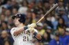 Milwaukee Brewers' Mark Canha hits an RBI single during the first inning of a baseball game against the Washington Nationals, Saturday, Sept. 16, 2023, in Milwaukee. (AP Photo/Aaron Gash)