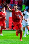 Heidenheim's Tim Kleindienst celebrates after scoring the opening goal during the German Bundesliga soccer match between 1. FC Heidenheim and Werder Bremen in Heidenheim, Germany, Sunday, Sept. 17, 2023. (Tom Weller/dpa via AP)