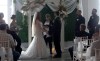 Sarah and Dave Roy are seen during their wedding in a still image made from video shot at the Garcelon Civic Centre in St. Stephen, N.B., Saturday, Sept. 16, 2023. Post-tropical storm Lee may have thrown a wrench into the Roy's wedding plans, but the newlyweds feel the upheaval it caused on their big day is nothing but a positive sign for their future life together. THE CANADIAN PRESS/Hina Alam