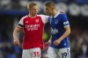 Arsenal's Oleksandr Zinchenko, left, talks to Everton's Vitaliy Mykolenko after the English Premier League soccer match between Everton and Arsenal at the Goodison Park stadium in Liverpool, England, Sunday, Sept. 17, 2023. (AP Photo/Jon Super)