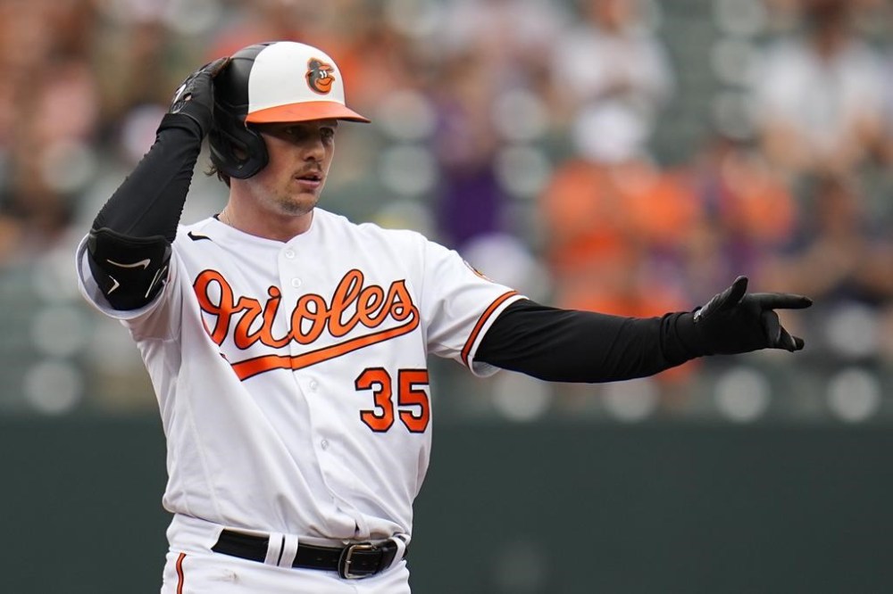Baltimore Orioles designated hitter Adley Rutschman reacts after hitting a double against the Tampa Bay Rays in the first inning of a baseball game, Sunday, Sept. 17, 2023, in Baltimore. (AP Photo/Julio Cortez)