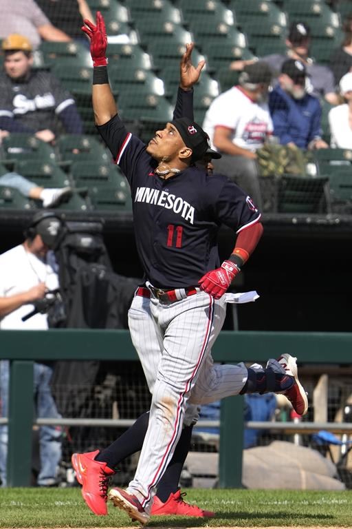 Minnesota Twins' Jorge Polanco (11) celebrates as he rounds the bases after hitting a solo home run during the eighth inning of a baseball game against the Chicago White Sox in Chicago, Sunday, Sept. 17, 2023. (AP Photo/Nam Y. Huh)