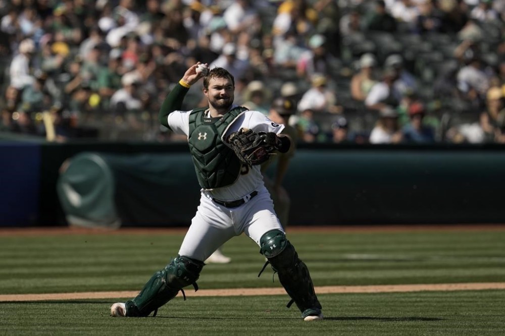 Oakland Athletics catcher Shea Langeliers throws to first for an out against San Diego Padres' José Azocar during the sixth inning of a baseball game Sunday, Sept. 17, 2023, in Oakland, Calif. (AP Photo/Godofredo A. Vásquez)
