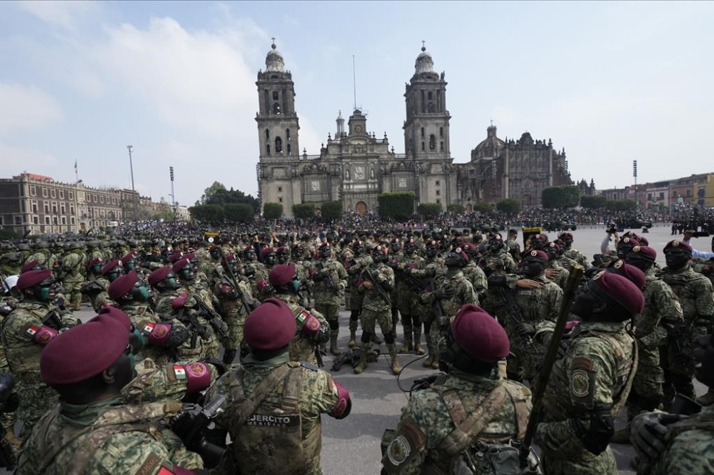 Members of the Mexican Armed Forces shout motivational slogans prior to the start of the Independence Day military parade, in the capital's main square, the Zocalo, in Mexico City, Saturday, Sept. 16, 2023. (AP Photo/Fernando Llano)