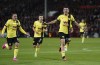 Burnley's Zeki Amdouni, right, celebrates scoring during the English Premier League soccer match between Burnley and Nottingham Forest at City Ground, Nottingham, England, Monday Sept. 18, 2023. (Joe Giddens/PA via AP)