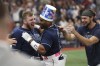 Tampa Bay Rays' Yandy Diaz, center, celebrates with teammates Luke Raley, left and Josh Lowe after hitting a walk off two-run home run against the Seattle Mariners during a baseball game Saturday, Sept. 9, 2023, in St. Petersburg, Fla. (AP Photo/Scott Audette)