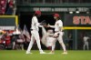 Cincinnati Reds' Elly De La Cruz, left, celebrates with Jonathan India, right, following a baseball game against the Minnesota Twins in Cincinnati, Monday, Sept. 18, 2023. (AP Photo/Jeff Dean)