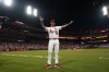 ;St. Louis Cardinals starting pitcher Adam Wainwright celebrates after earning the win in a baseball game against the Milwaukee Brewers for his 200th career victory Monday, Sept. 18, 2023, in St. Louis. (AP Photo/Jeff Roberson)