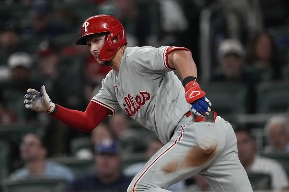 Philadelphia Phillies shortstop Trea Turner (7) runs to first on a single in the fifth inning of a baseball game against the Atlanta Braves Monday, Sept. 18, 2023. (AP Photo/John Bazemore)
