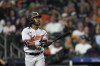 Baltimore Orioles' Cedric Mullins watches his three-run home run against the Houston Astros during the ninth inning of a baseball game Monday, Sept. 18, 2023, in Houston. (AP Photo/David J. Phillip)