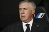 Real Madrid's head coach Carlo Ancelotti sits at the bench prior to Spanish La Liga soccer match between Real Madrid and Real Sociedad at the Santiago Bernabéu stadium in Madrid, Spain, Sunday, Sept. 17, 2023. (AP Photo/Jose Breton)