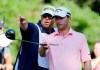 FILE - Kevin Kisner, right, listens to his caddie Duane Bock, before hitting on the 15th tee during the third round of The Players Championship golf tournament on May 9, 2015, in Ponte Vedra Beach, Fla. The American caddie will be part of Team Europe when he works for Sepp Straka of Austria in the Ryder Cup in Italy. (AP Photo/Chris O'Meara, File)