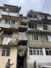 In this photo released by Gegham Stepanyan, Ombudsman of Human Rights of the Artsakh Republic in the breakaway territory of Nagorno-Karabakh in Azerbaijan in his Twitter account on Tuesday, Sept. 19, 2023, a damaged residential apartment building following shelling is seen in Stepanakert in the breakaway territory of Nagorno-Karabakh in Azerbaijan. Azerbaijan on Tuesday declared that it started what it called an 