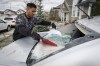 Severe summer storms in Alberta and the Prairies this year resulted in over $300 million in insured losses, according to the initial estimates from Catastrophe Indices and Quantification Inc. Sukh Singh, 22, sweeps up broken glass from his car as cleanup begins in Calgary, Alta., Sunday, June 14, 2020, after a major hail storm. THE CANADIAN PRESS/Jeff McIntosh