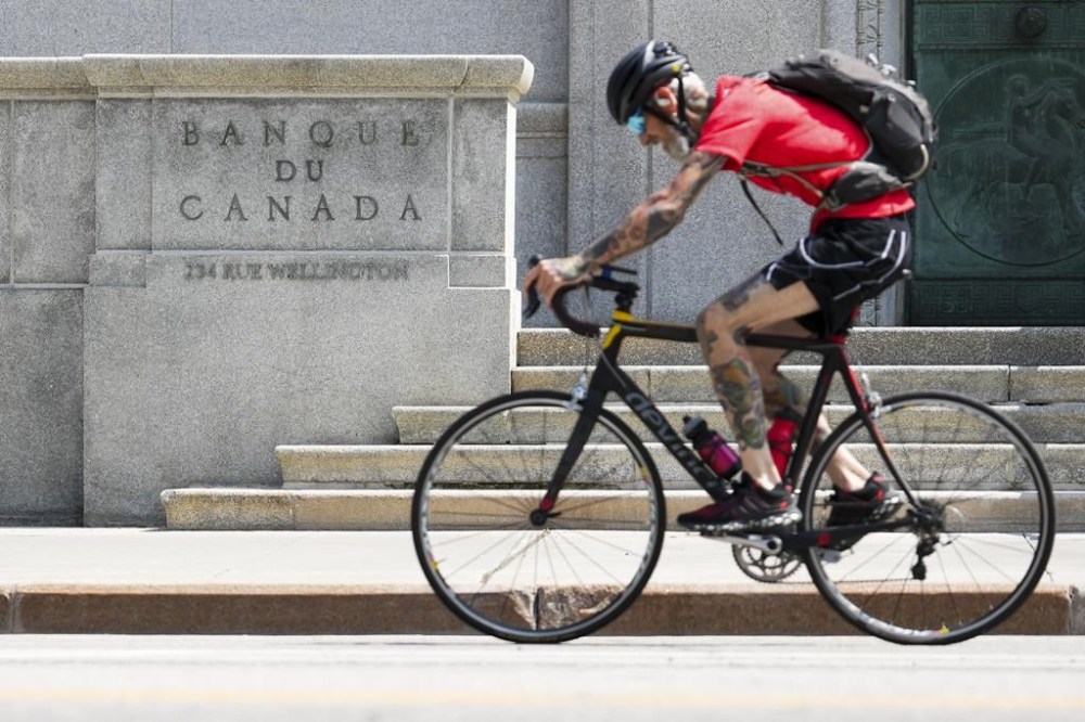 Bank of Canada deputy governor Sharon Kozicki says ups and downs in the inflation rate are not unusual, after the latest consumer price index report showed inflation rose again in August. A cyclist makes their way past the Bank of Canada in Ottawa on Tuesday, July 11, 2023. THE CANADIAN PRESS/Sean Kilpatrick