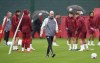 Manchester United's manager Erik ten Hag, center, walks on the pitch during a training session at Carrington, Manchester, England, Tuesday, Sept. 19, 2023. Manchester United will face FC Bayern Munich for a Champions League group A soccer match in Munich on Sept. 20, 2023. (Martin Rickett/PA via AP)