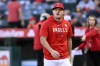 FILE - Los Angeles Angels' Mike Trout walks to the dugout before the team's baseball game against the Detroit Tigers in Anaheim, Calif., Sept. 15, 2023. Trout has accompanied the team on its last road trip of the season and took dry swings before Tuesday night’s game at the Tampa Bay Rays. The three-time AL MVP has played just one game since fracturing the hamate bone in his left hand on July 3. The center fielder returned Aug. 22 but was shut down the next day due to discomfort. (AP Photo/Alex Gallardo, File)