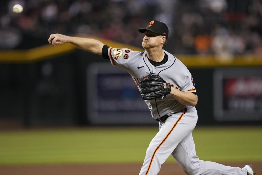 San Francisco Giants starting pitcher Alex Cobb throws against the Arizona Diamondbacks during the first inning of a baseball game, Tuesday, Sept. 19, 2023, in Phoenix. (AP Photo/Matt York)