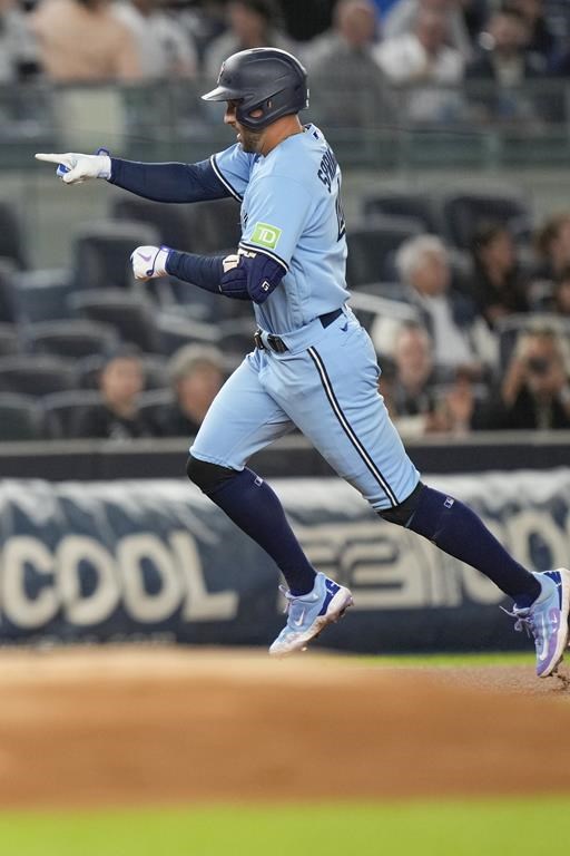 Toronto Blue Jays' George Springer celebrates his home run against the New York Yankees during the first inning of a baseball game Tuesday, Sept. 19, 2023, in New York. (AP Photo/Bryan Woolston)