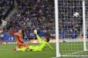 Inter Milan's Lautaro Martinez, left, beats Real Sociedad's goalkeeper Alex Remiro to score his side's first goal during a Group D Champions League soccer match between Real Sociedad and Inter Milan at the Real Arena stadium in San Sebastian, Spain, Wednesday, Sept. 20, 2023. (AP Photo/Alvaro Barrientos)