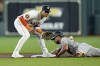 Baltimore Orioles' Anthony Santander, right, steals second base as Houston Astros shortstop Jeremy Pena waits for the throw during the first inning of a baseball game Wednesday, Sept. 20, 2023, in Houston. (AP Photo/David J. Phillip)
