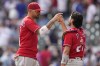 Philadelphia Phillies right fielder Nick Castellanos, left, celebrates with Philadelphia Phillies catcher Garrett Stubbs (21) after a win against the Atlanta Braves, Wednesday, Sept. 20, 2023, in Atlanta. (AP Photo/Brynn Anderson)
