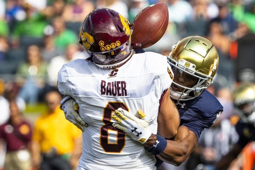 Notre Dame's Thomas Harper (13) forces Central Michigan's Jase Bauer (8) to fumble as he sacks him during the first half of an NCAA college football game on Saturday, Sept. 16, 2023, in South Bend, Ind. (AP Photo/Michael Caterina)