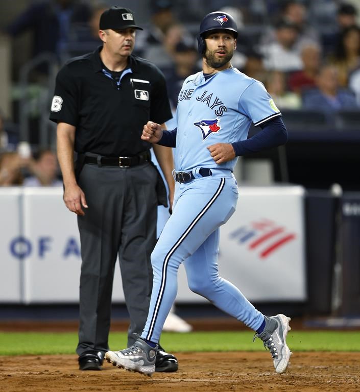 Blue Jays' Kevin Kiermaier scores against the New York Yankees during the third inning of a baseball game, Wednesday, Sept. 20, 2023, in New York. (AP Photo/Noah K. Murray)