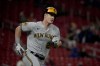 Milwaukee Brewers' Mark Canha rounds first on his way to a three-run double during the ninth inning of a baseball game against the St. Louis Cardinals Wednesday, Sept. 20, 2023, in St. Louis. (AP Photo/Jeff Roberson)