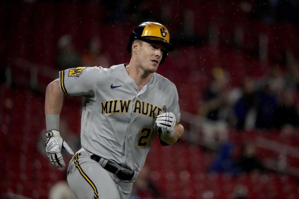 Milwaukee Brewers' Mark Canha rounds first on his way to a three-run double during the ninth inning of a baseball game against the St. Louis Cardinals Wednesday, Sept. 20, 2023, in St. Louis. (AP Photo/Jeff Roberson)