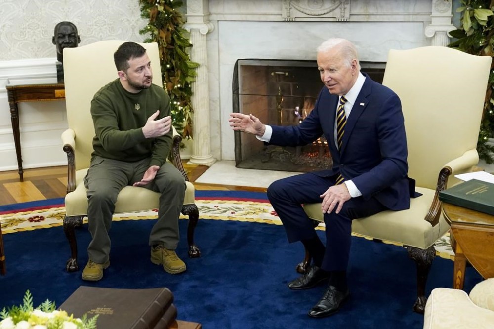FILE - President Joe Biden speaks with Ukrainian President Volodymyr Zelenskyy as they meet in the Oval Office of the White House, Dec. 21, 2022, in Washington. Zelenskyy arrives in Washington for a whirlwind return visit, this time to face the Republicans now questioning the flow of American dollars that has kept his troops in the fight against Russian forces. (AP Photo/Patrick Semansky, File)