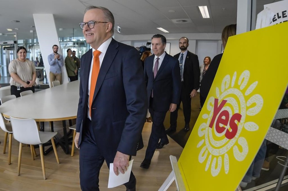 Australian Prime Minister Anthony Albanese, foreground, walks past a